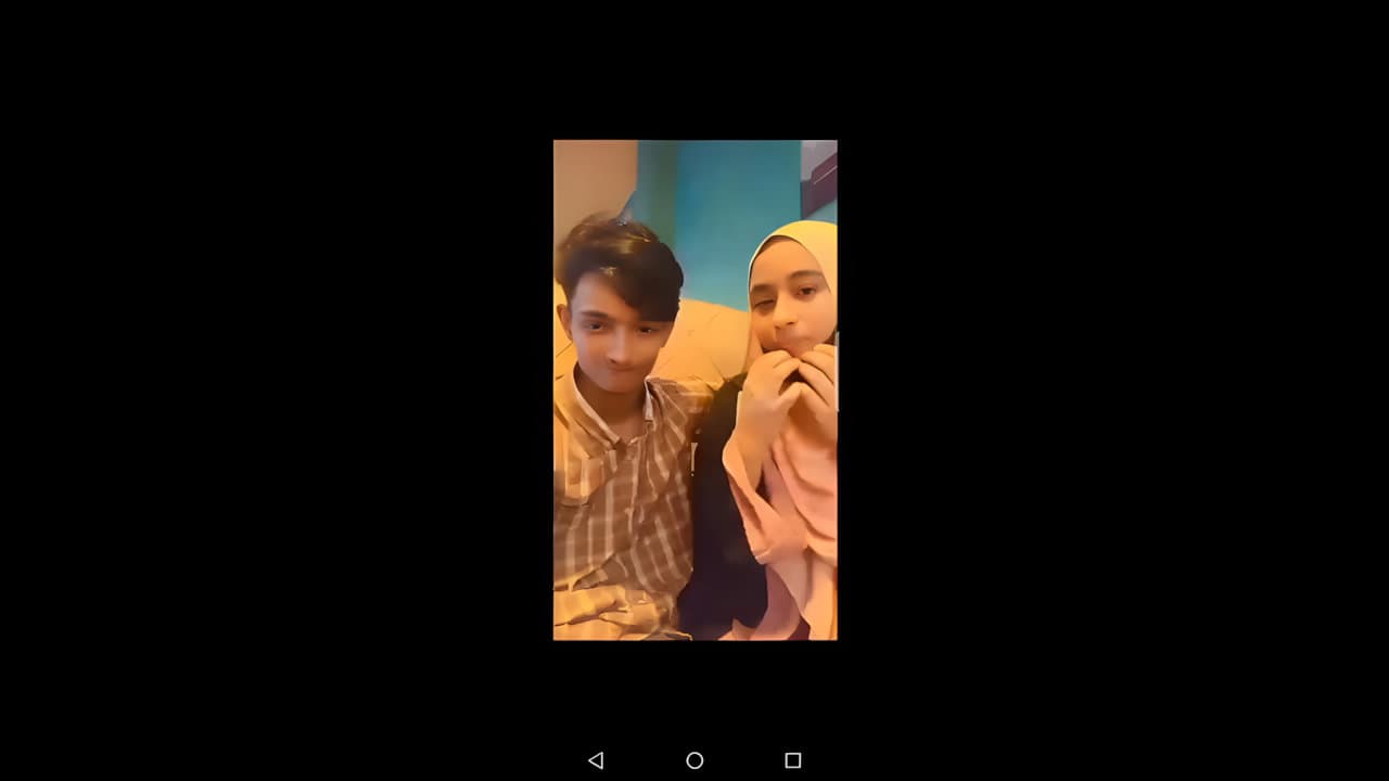 Young Boy Enjoying With His Hijabi Girlfriend in Restaurant