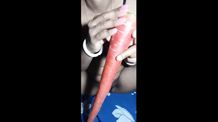Naughty Girl Stretches Pussy with Long Carrots
